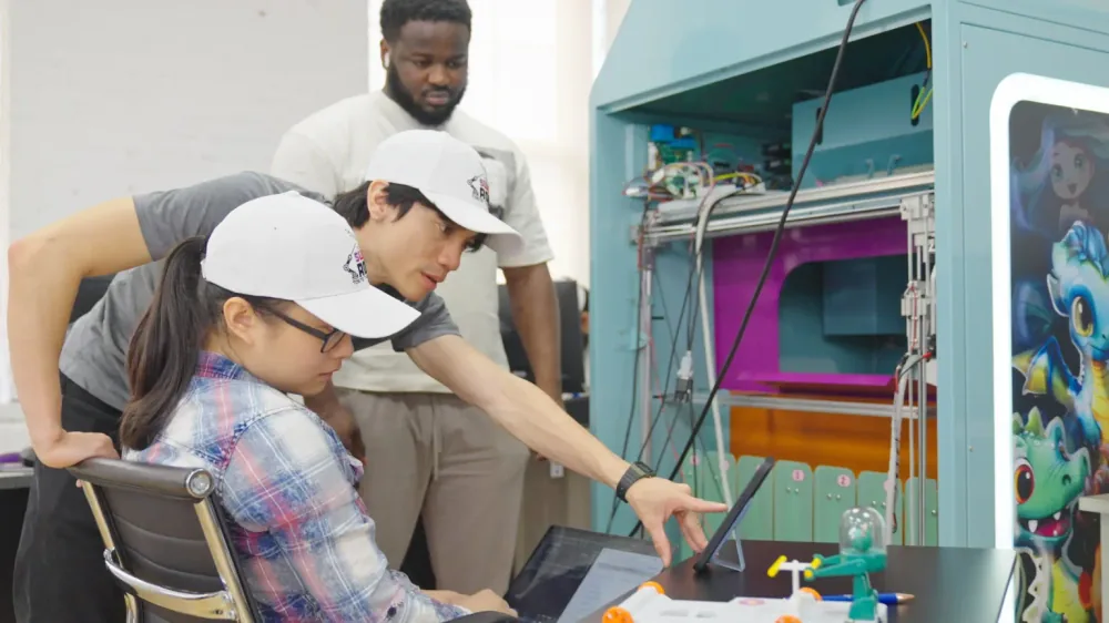 Sweet Robo engineers designing and building a custom vending machine